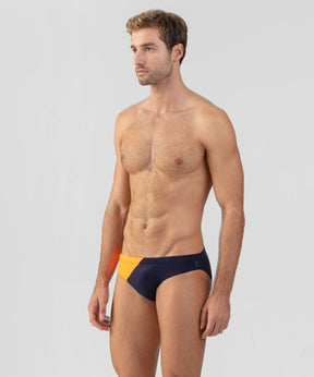Slip de bain échancré bicolore: Bleu marine/orange fluo